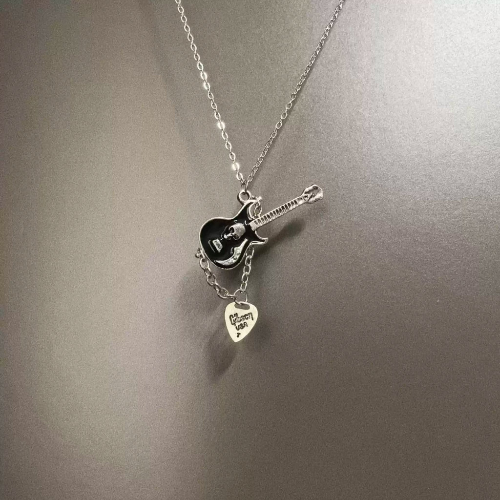 Vintage Skull guitarist necklace